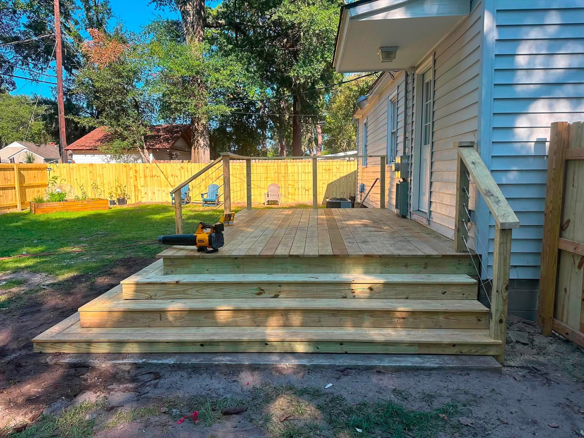 Wide pressure-treated deck with full-width steps