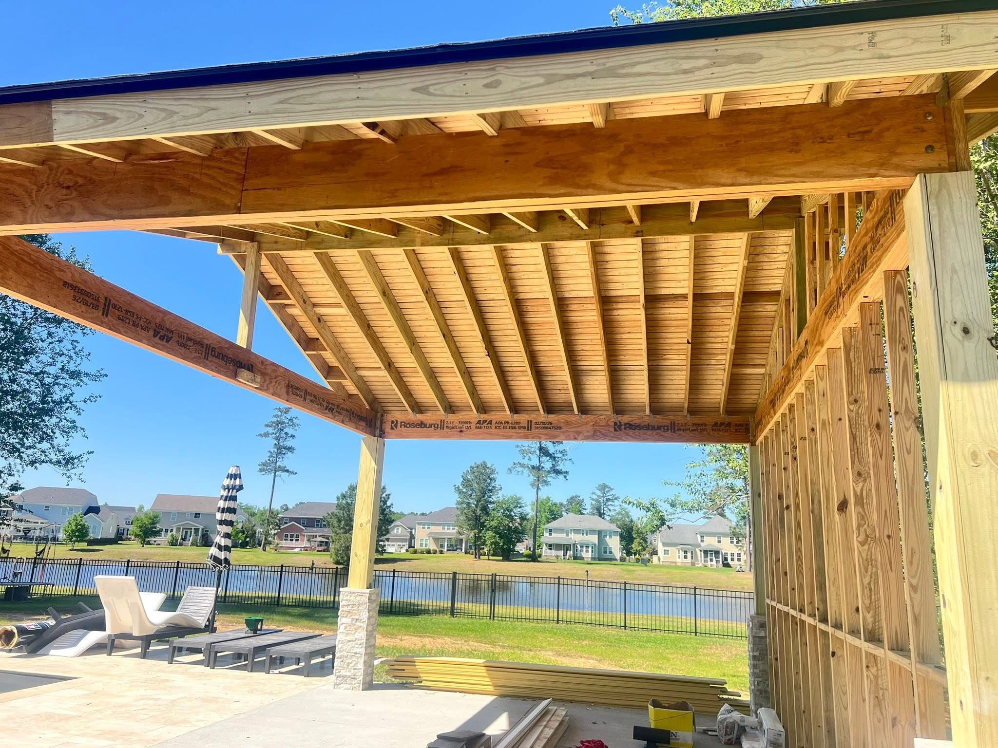 Timber pavilion framing over a pool patio, built by Lalo's Home Improvements